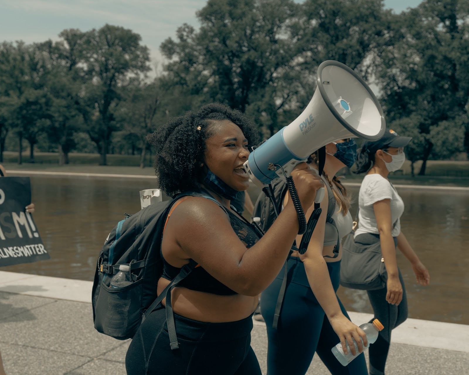 A woman chants into a megaphone during a Black Lives Matter rally